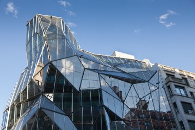 Modern glass building in Bilbao, Spain clipart