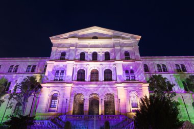 Facade illuminated of the University of Deusto in Bilbao clipart