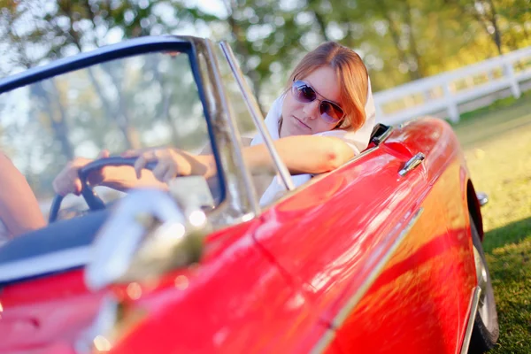 Girl in red cabriolet — Stock Photo, Image
