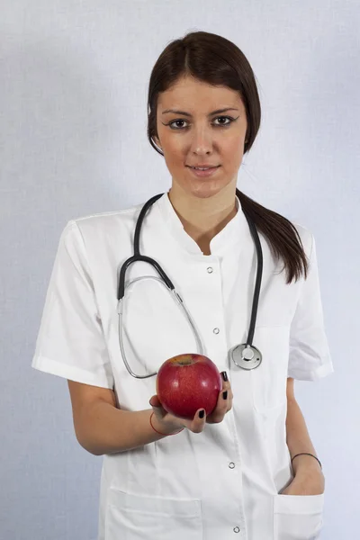 Doutor com uma maçã — Fotografia de Stock