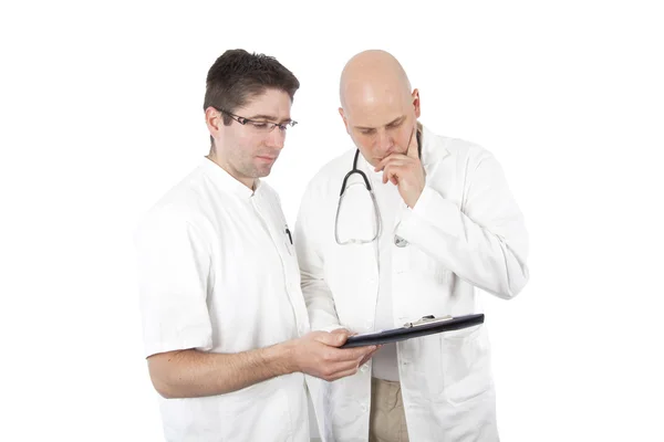 Two doctors with a chart — Stock Photo, Image