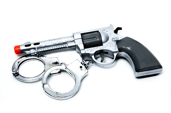 stock image Toy gun and handcuffs