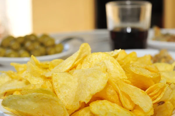 Potato chips and other appetizers — Stock Photo, Image