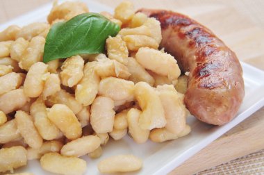 Botifarra amb mongetes, pork sausage with white beans, a typical clipart