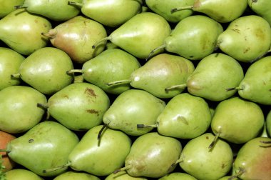 A pile of pears in a vegetables market clipart