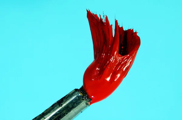 Brush with red paint — Stock Photo, Image