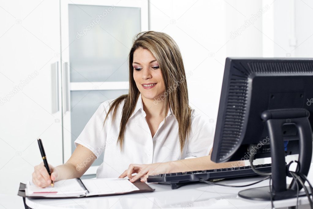 Secretary with pen and computer