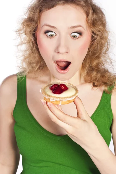 Žena jíst dort. ve studiu — Stock fotografie