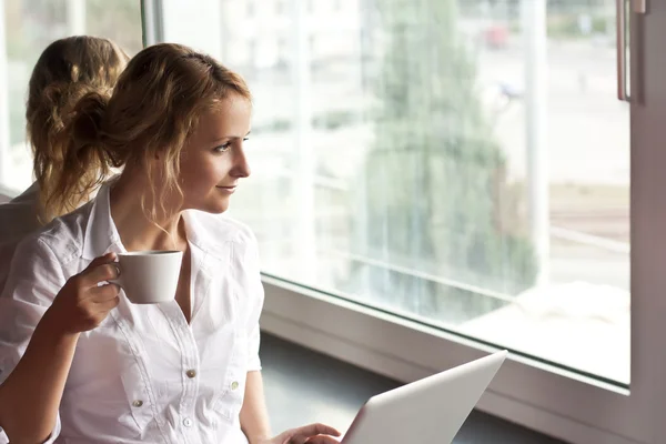 Picture of pensive woman with laptop computer — Stock Photo, Image