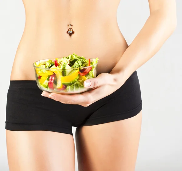 Happy healthy woman with salad. Studio shoot — Stock Photo, Image