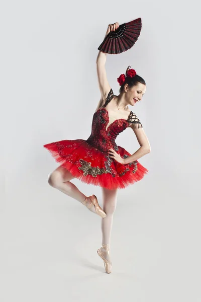 Tender lean dancer Carmen in a red dress — Stock Photo, Image