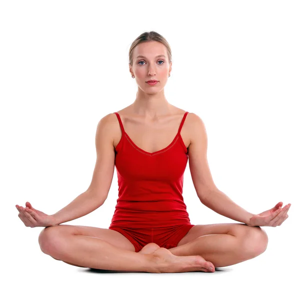 Oung Frau praktiziert Yoga in der Lotusposition — Stockfoto