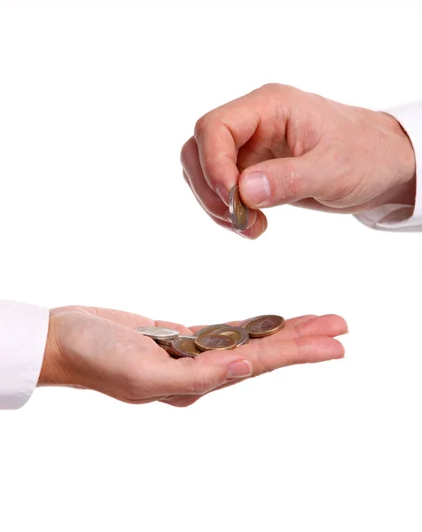 Manlig hand ger ett euromynt till en annan person — Stockfoto