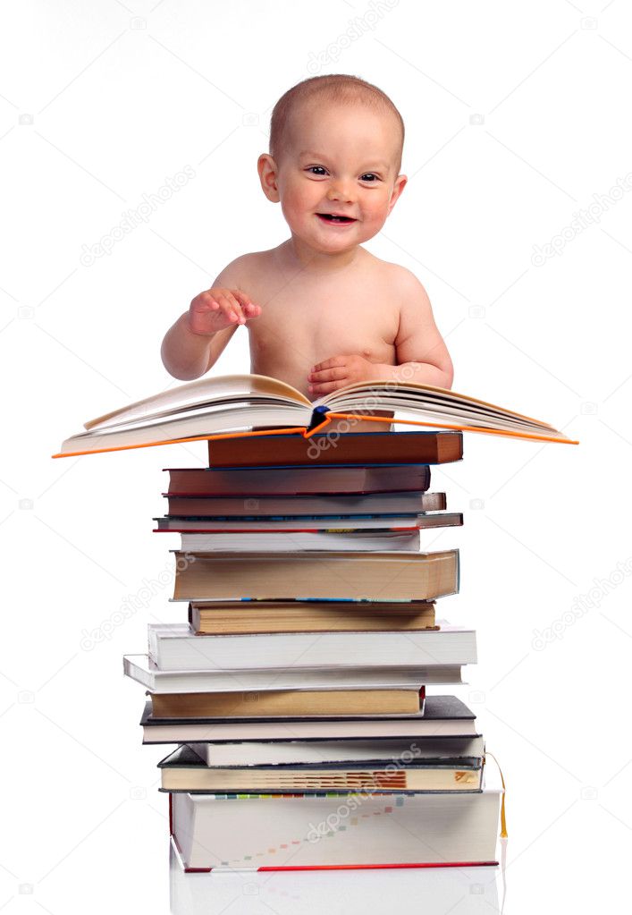 Portrait of a little boy with a stack of books