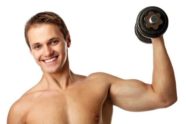 ダンベルを持ち上げる筋肉の若い男 — ストック写真