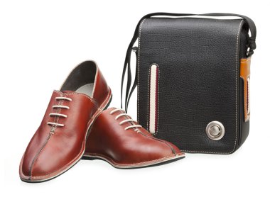 Pair of brown men shoes and black bag isolated over white clipart