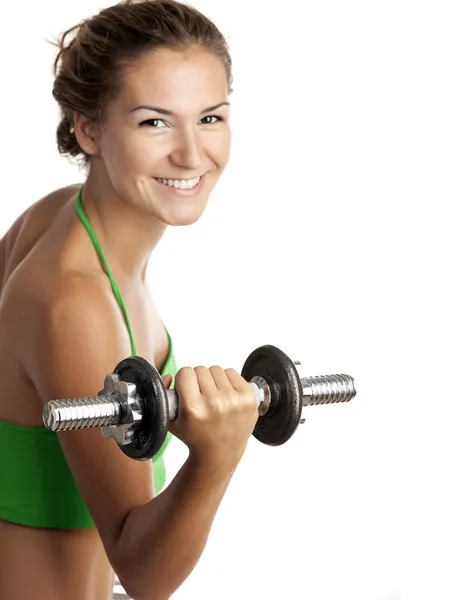 Linda chica de fitness haciendo ejercicio con pesas sobre fondo blanco —  Fotos de Stock