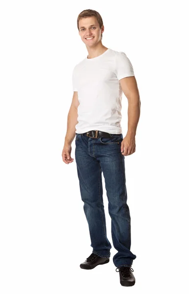Lunghezza completa di un giovane uomo carino in jeans e t-shirt — Foto Stock