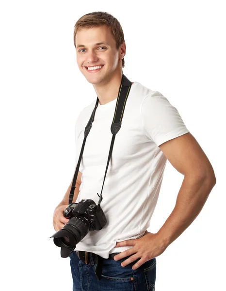 Portrait of a handsome young man with a camera — Stock Photo, Image