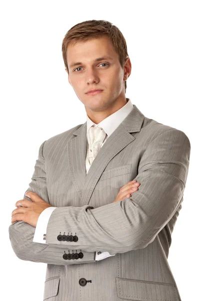 Young attractive man standing with arms crossed — Stock Photo, Image