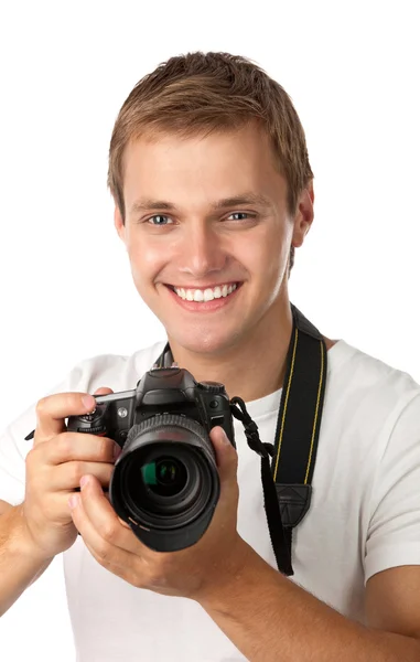 Portrait of a handsome young man holding a camera — Stock Photo, Image