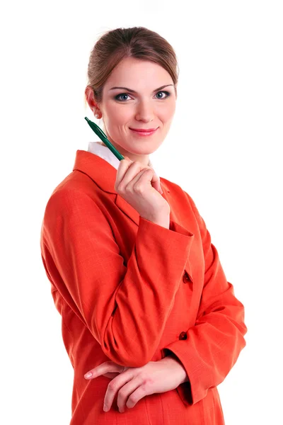 Young business woman holding pen, looking at camera and smiling — Stock Photo, Image