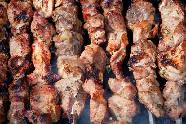 stock image Background of grilled shish kebabs on skewers