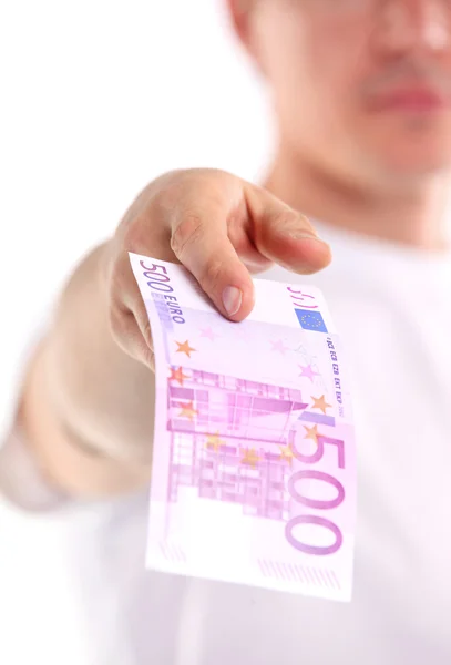 Joven hombre caucásico sosteniendo quinientos billetes en euros — Foto de Stock