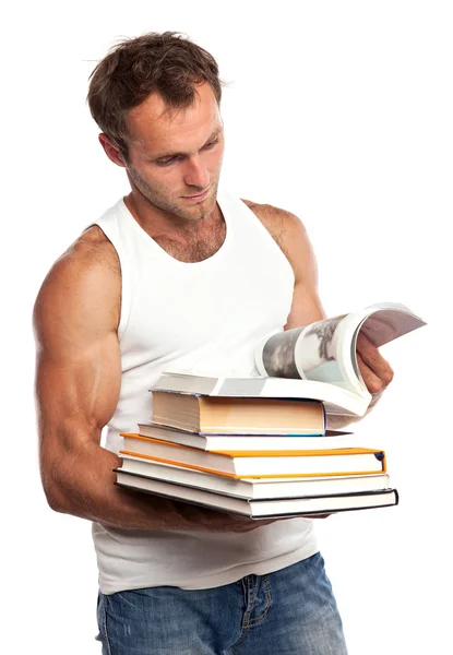Hombre caucásico con una pila de libros sobre blanco — Foto de Stock