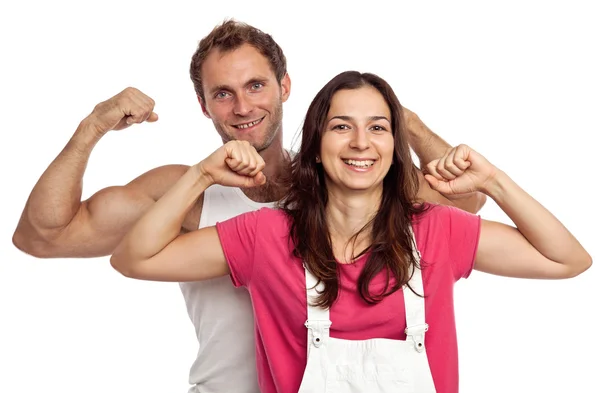 Jovem casal flexão bíceps sobre fundo branco — Fotografia de Stock