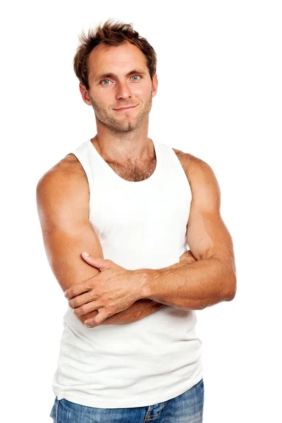 Portrait of handsome young man standing with arms crossed — Stock Photo, Image