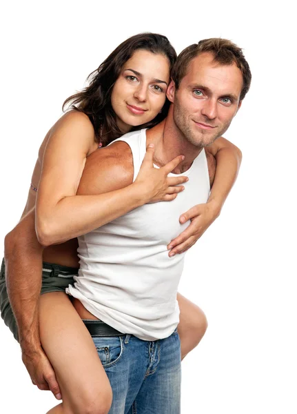 Ρομαντικό ζευγάρι διασκεδάζοντας στο στούντιο πάνω από λευκό — Φωτογραφία Αρχείου