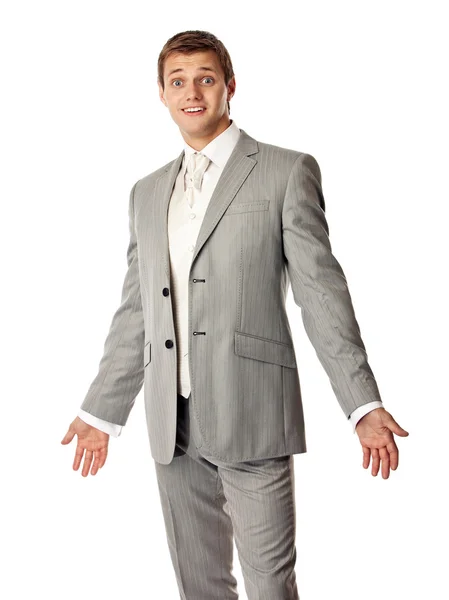Junger kaukasischer Mann im Anzug schaut erstaunt — Stockfoto