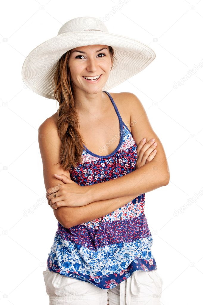 Pretty girl in summer clothing and wearing a hat