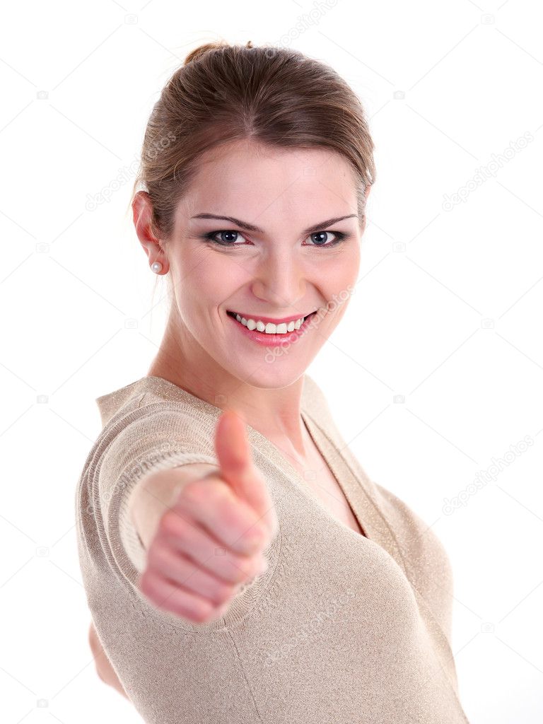Smiling brightly young woman showing thumb up sign