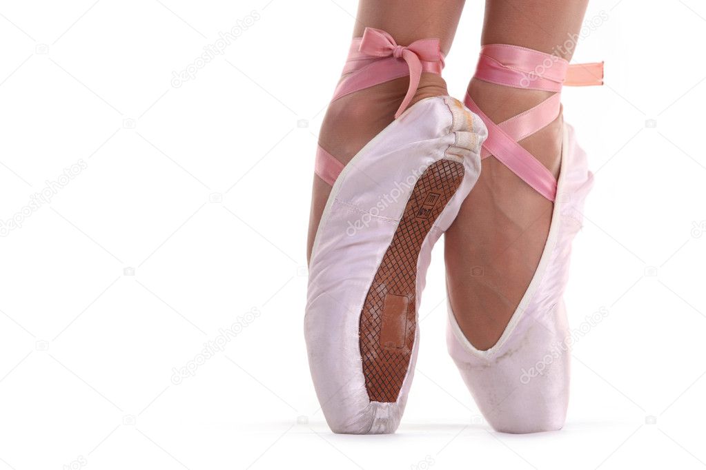 Closeup view of ballerina's feet on pointes