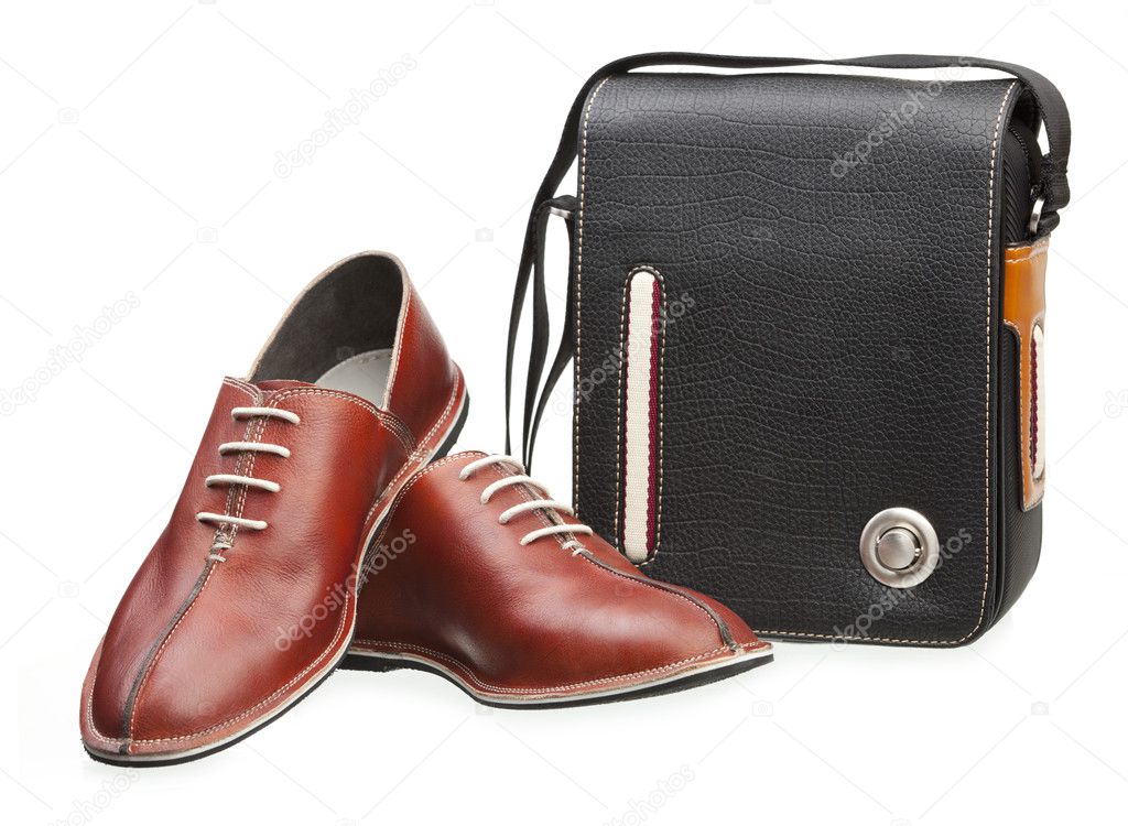 Pair of brown men shoes and black bag isolated over white