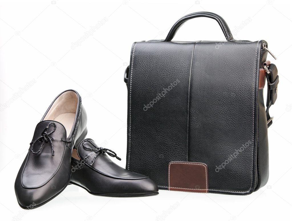 Pair of black men shoes and messenger bag isolated over white