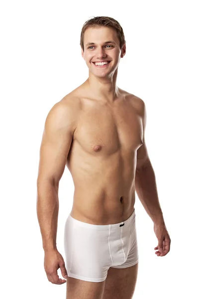 Pohledný mladý muž v prádle proti Bílému pozadí — Stock fotografie