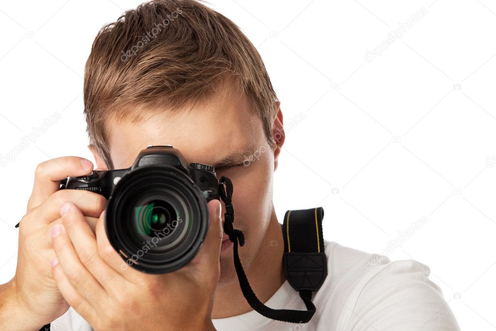 Closeup portrait of a young man taking a picture over white background