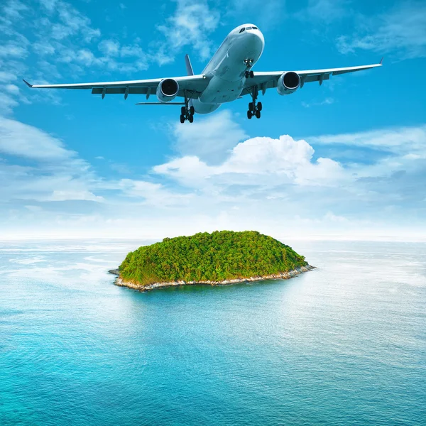 Jet plane over the tropical island — Stock Photo © vladmoses #11734660