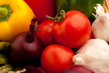 Basketo of vegetables, pepper, tomato, garlic, sparagus and gar clipart