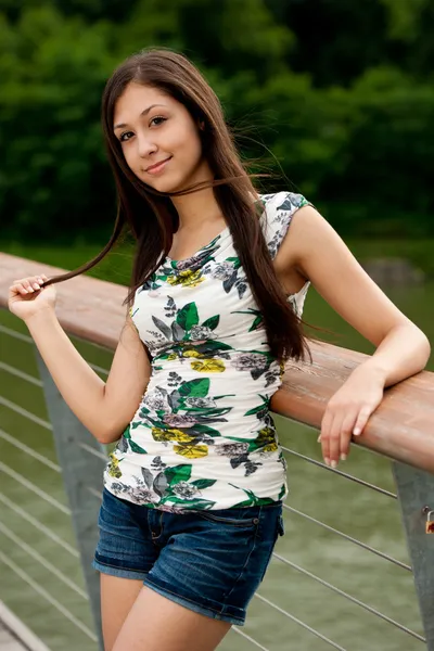 Young woman on a bridge — Stock Photo, Image