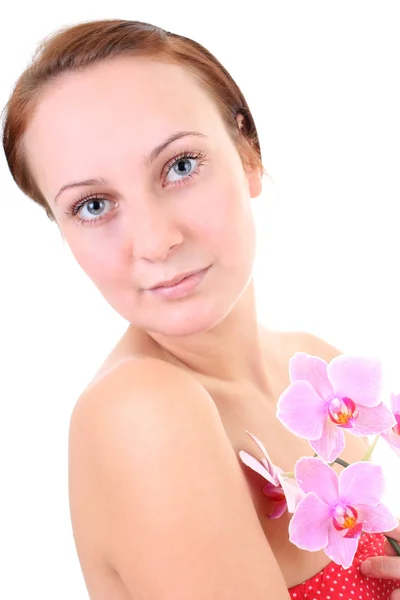 Närbild porträtt av unga friska rödhårig kvinna med orkidé — Stockfoto