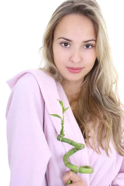 Portrait of young beautiful woman in bathrobe with bamboo — Stock Photo, Image