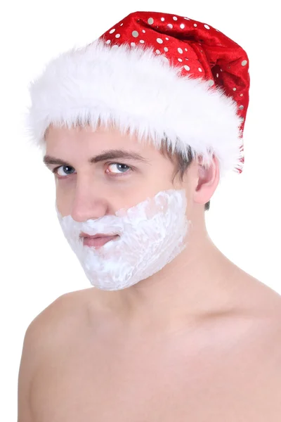 Jovem com a barba de espuma no chapéu de Papai Noel — Fotografia de Stock