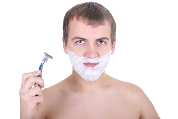 Junger Mann mit Rasiermesser und Rasierschaum — Stockfoto