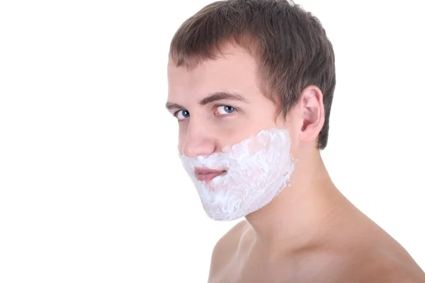 Молодой человек с пеной для бритья — стоковое фото