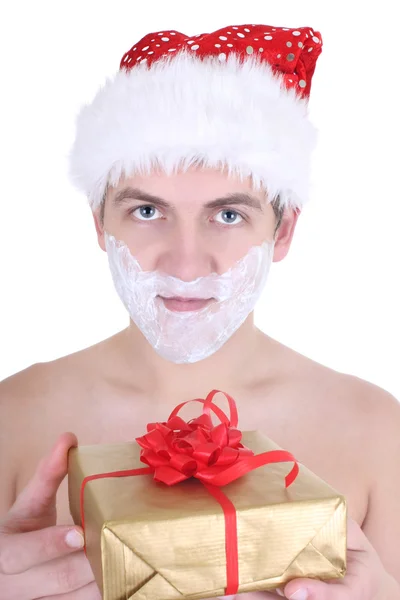 Young man with shaving foam in santa hat — Stock Photo, Image