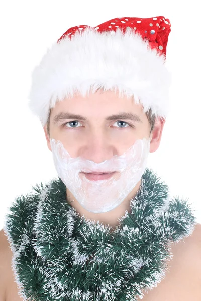 Young man with shaving foam in santa hat — Stok Foto